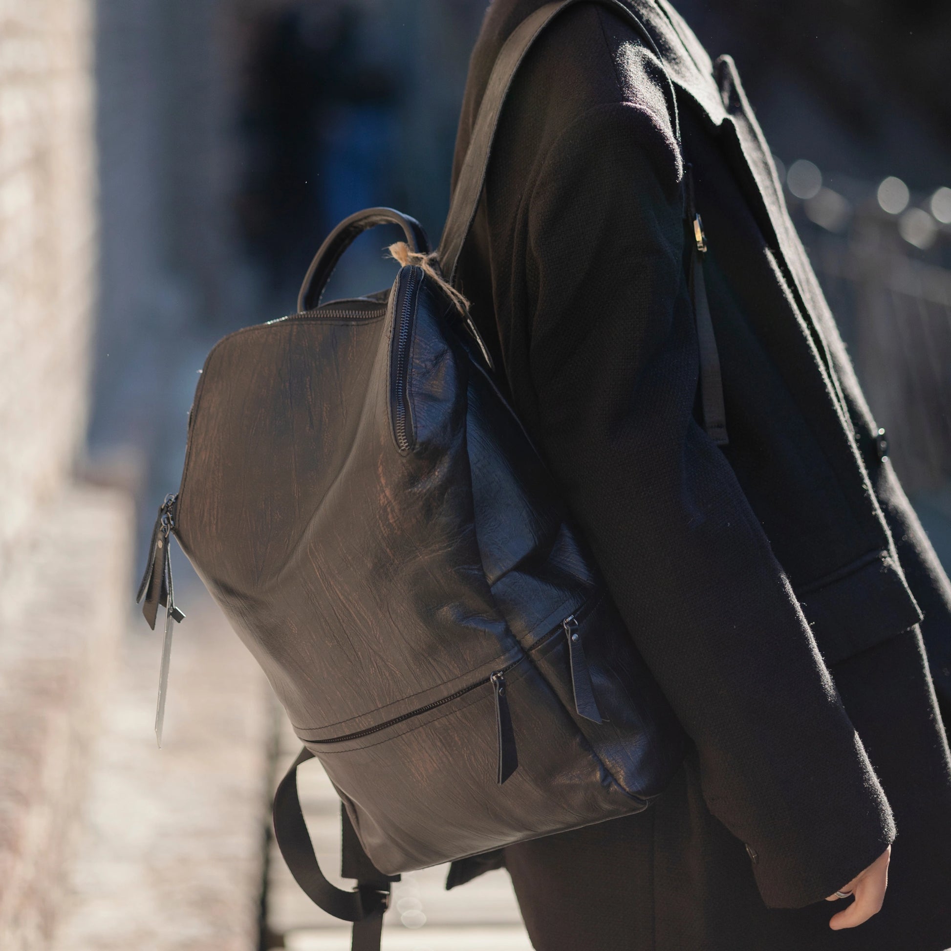 Patent Leather Backpack worn by a model