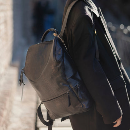 Patent Leather Backpack worn by a model