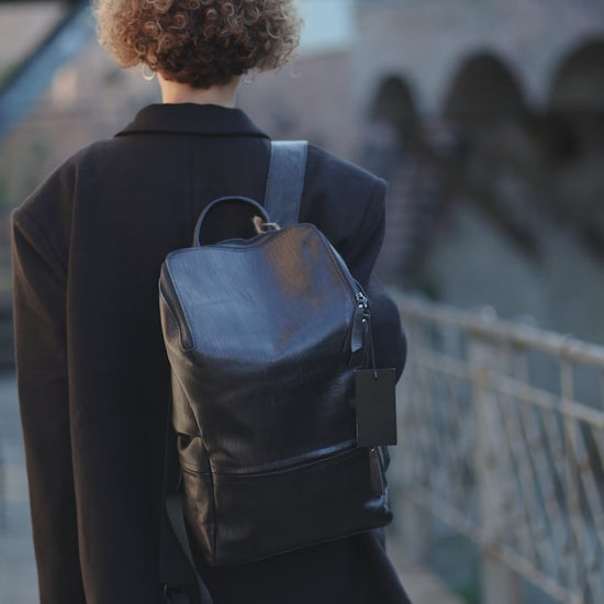 Hokaia Patent Leather Maroon Backpack worn by a model