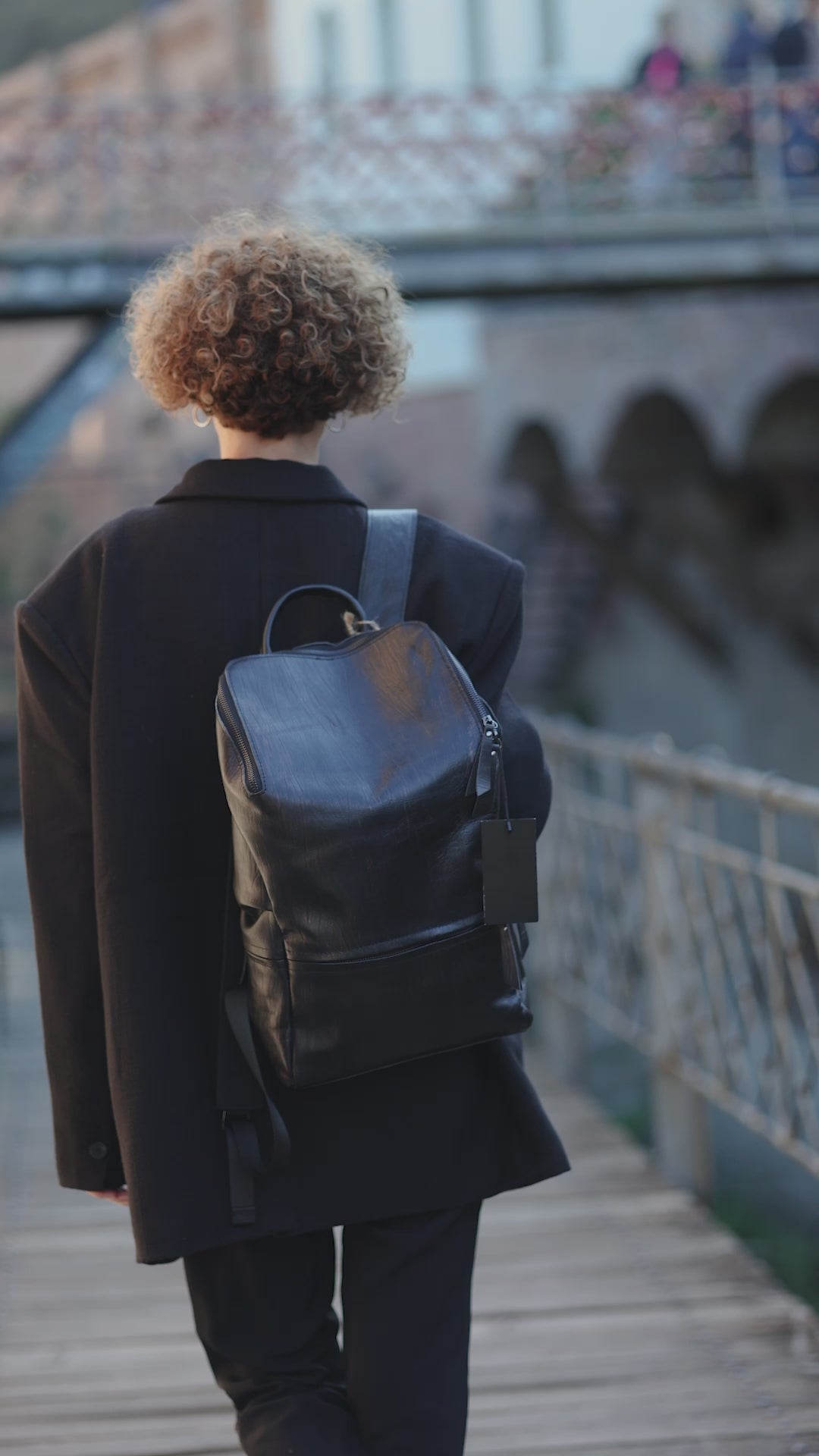 Hokaia Patent Leather Maroon Backpack worn by a model