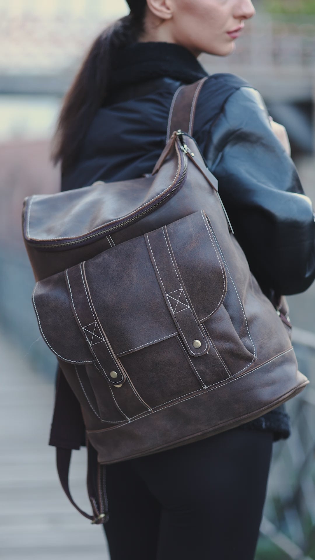 model showing off Hokaia backpack